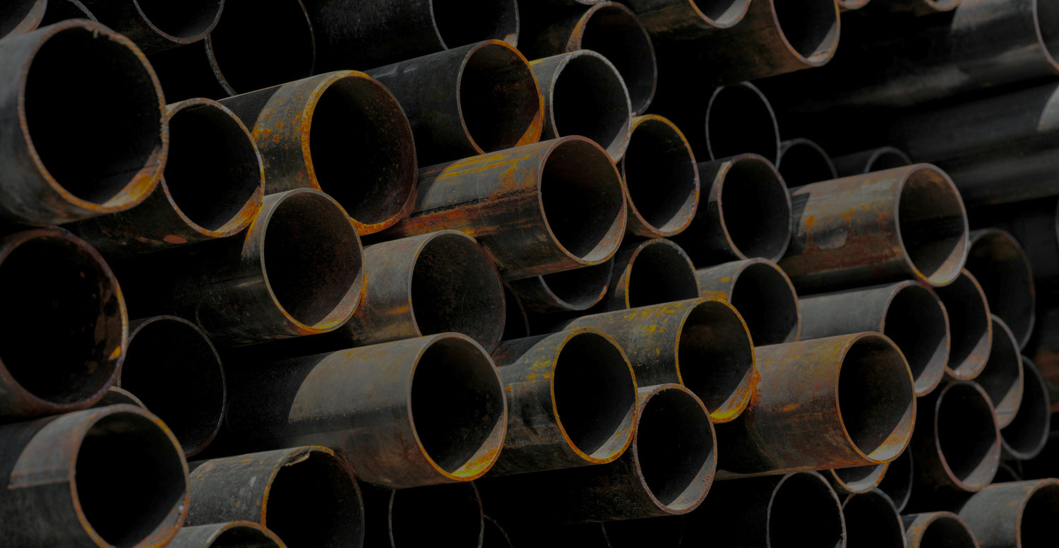 Stack of rusted metal pipes